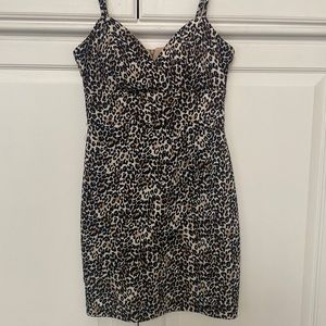 Leopard print cocktail dress from Teeze Me through Macy’s. Padding on chest